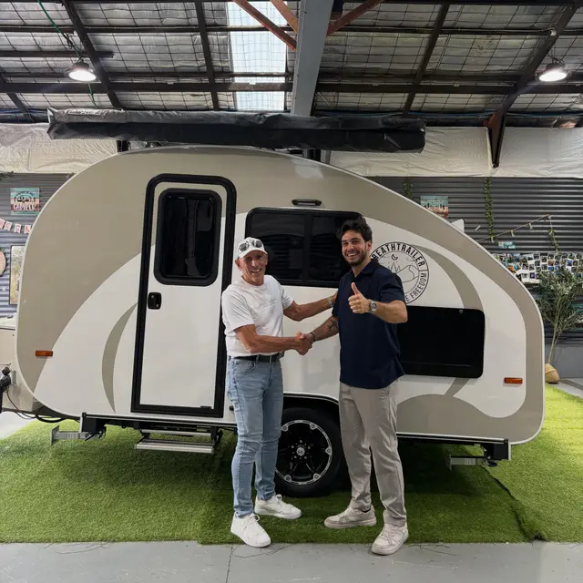 Andrew with their Breath Trailer at handover