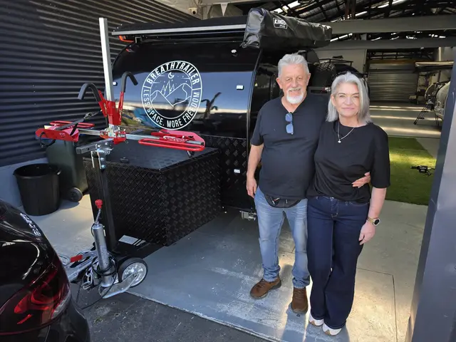 Customers collecting their black Breath Trailer at the workshop