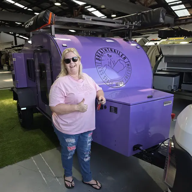 A customer with a purple Breath Trailer on collection day