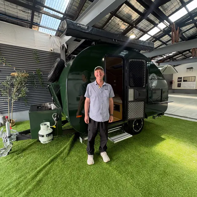 Rob with their Breath Trailer at handover