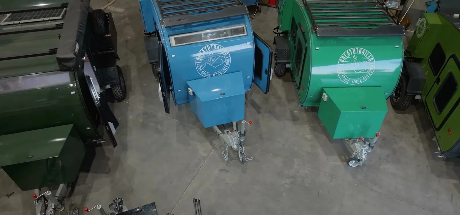 Several colourful Breath trailers together in the workshop