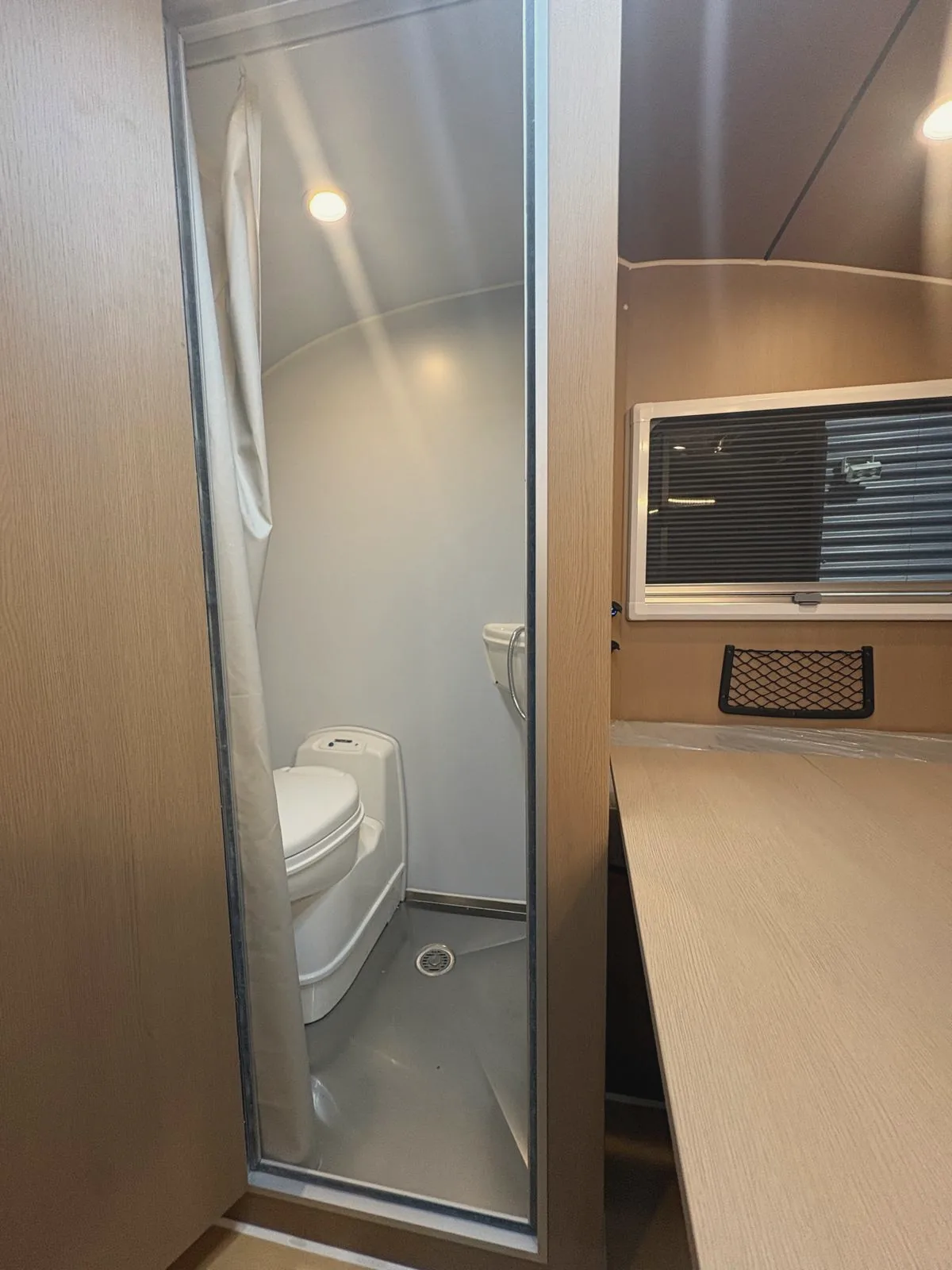 The toilet and shower cubicle