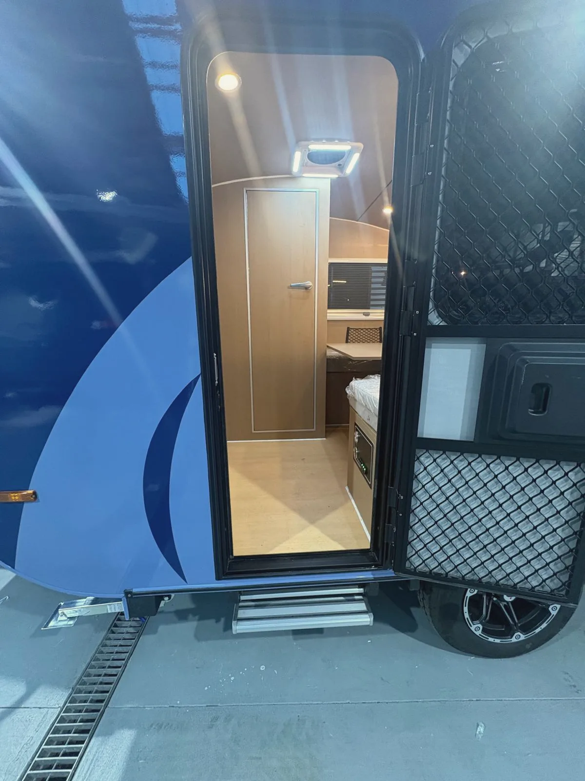 The screened, lockable door and step