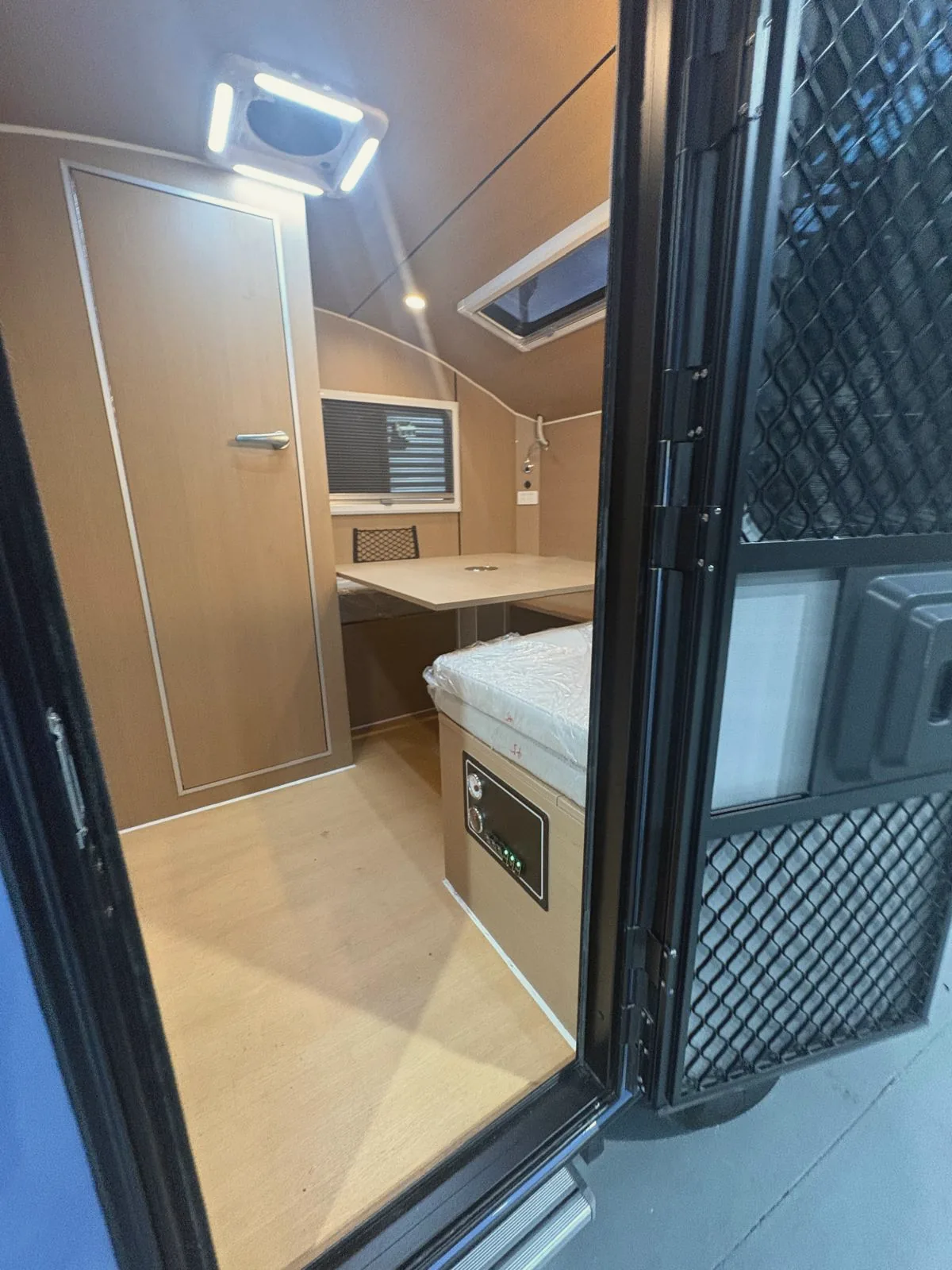 Inside the new Max: standing room, bed and dinette