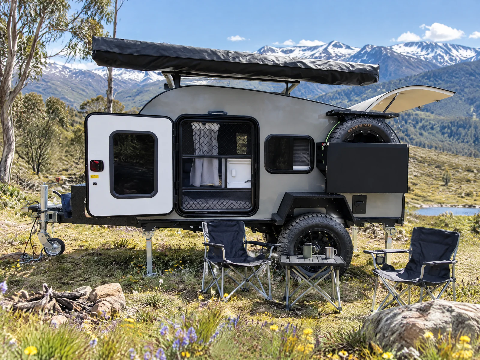 Breath Ultra at an alpine summer campsite with wildflowers and snow-capped peaks