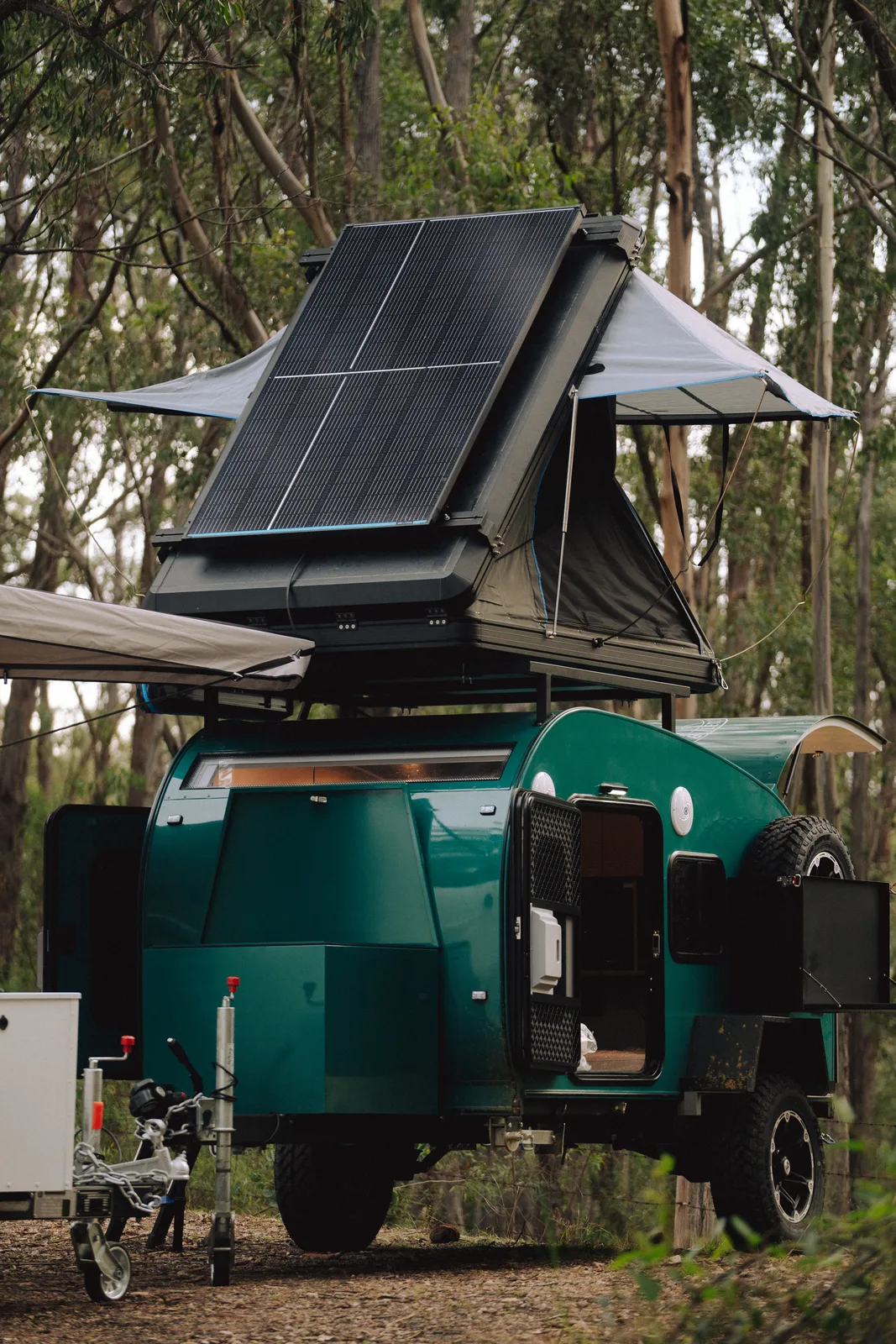 Breath Plus parked in bushland with rooftop tent folded