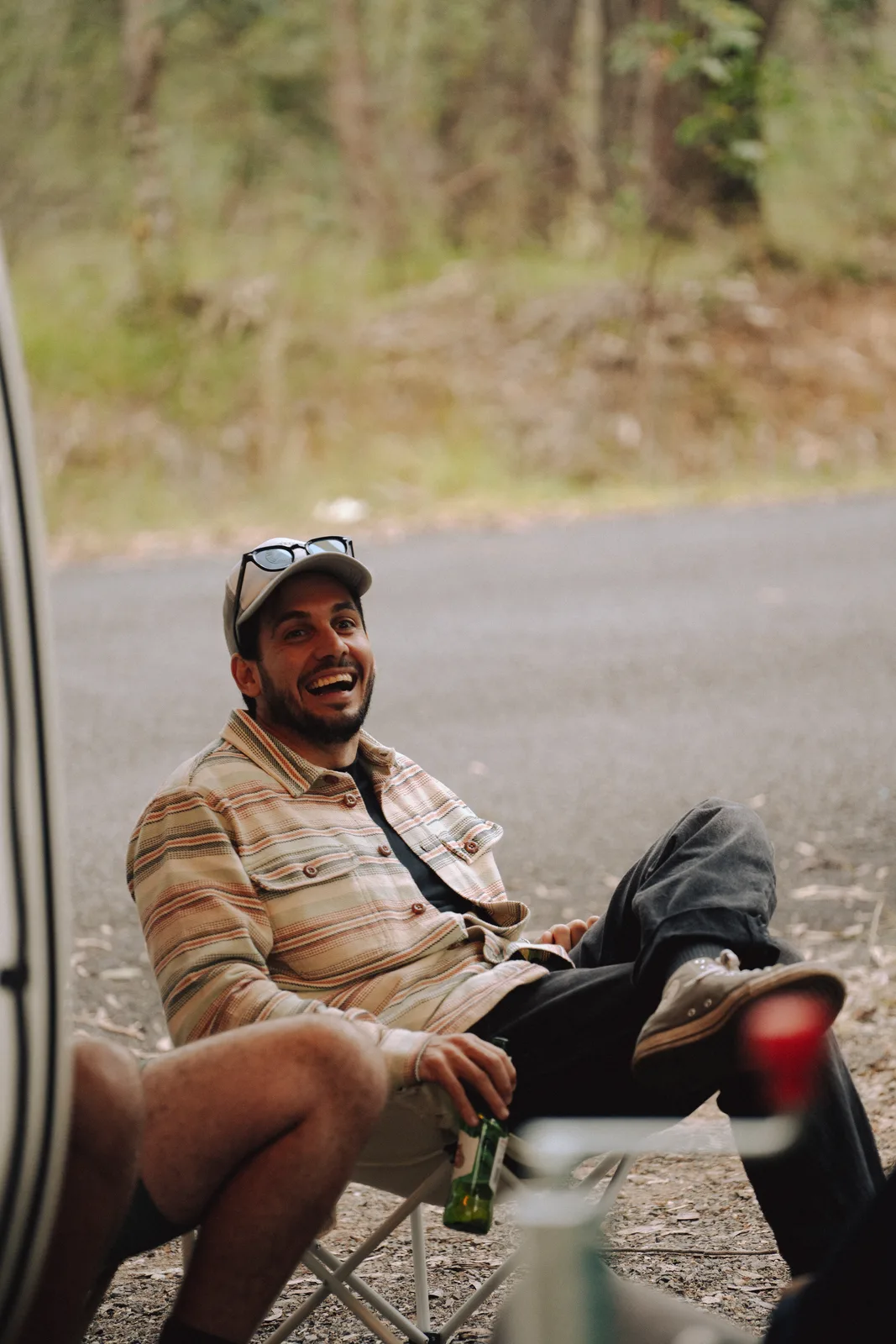 Breath Plus owner laughing in camp chair