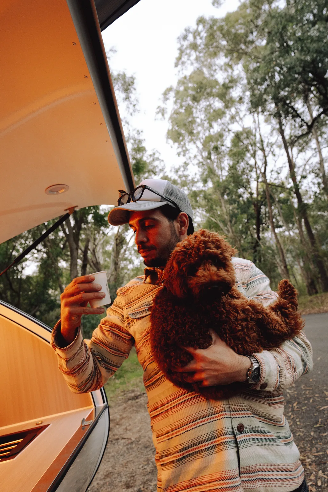 Breath Plus owner with cockapoo at the rear hatch