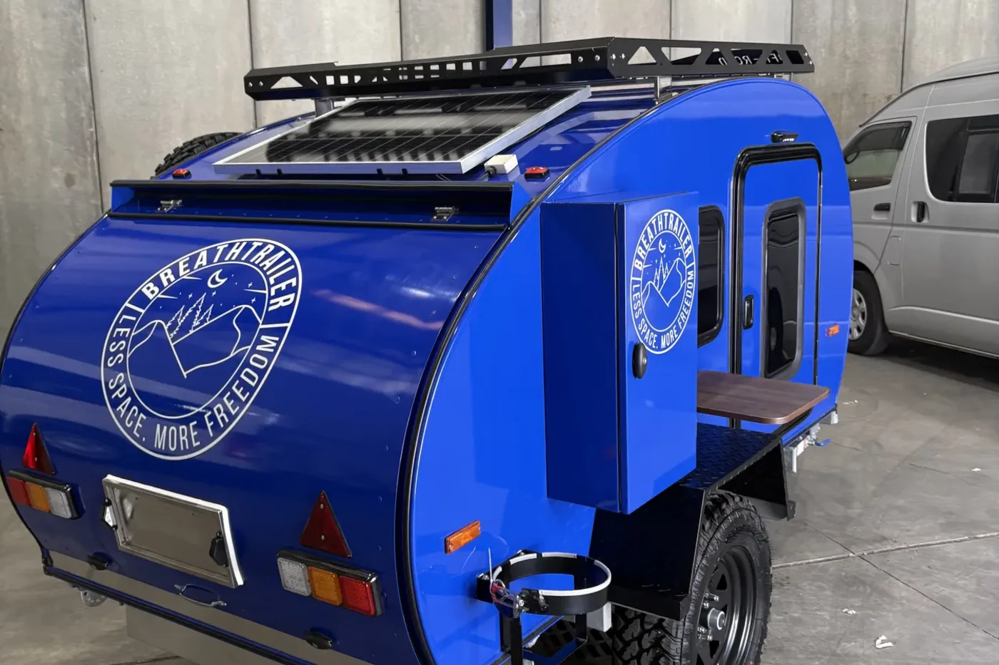 Breath Essential teardrop camper rear view with roof rack