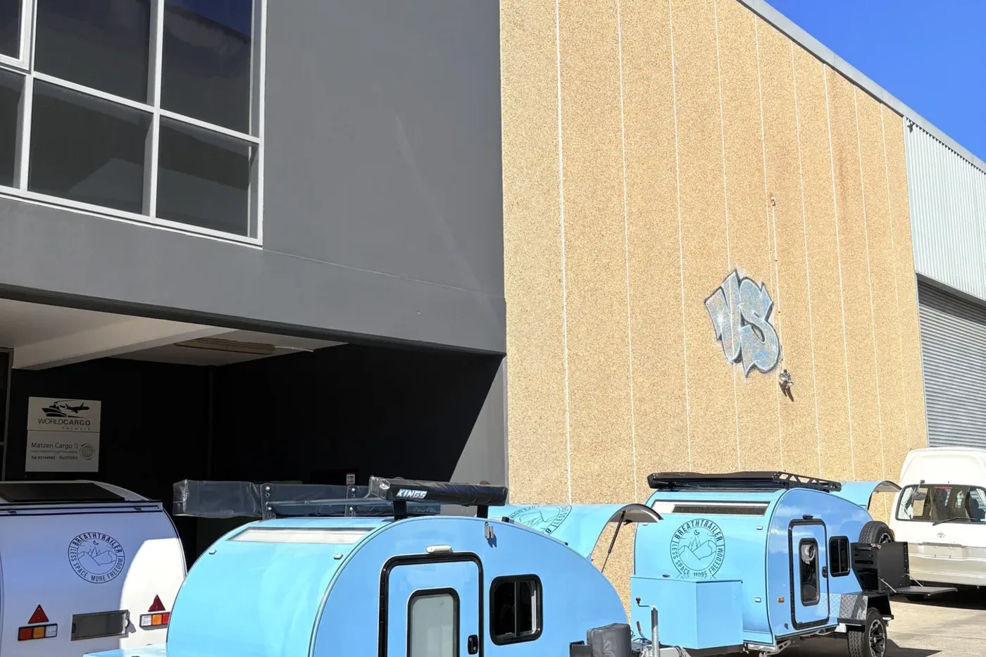 Breath Trailer campers lined up outside the workshop