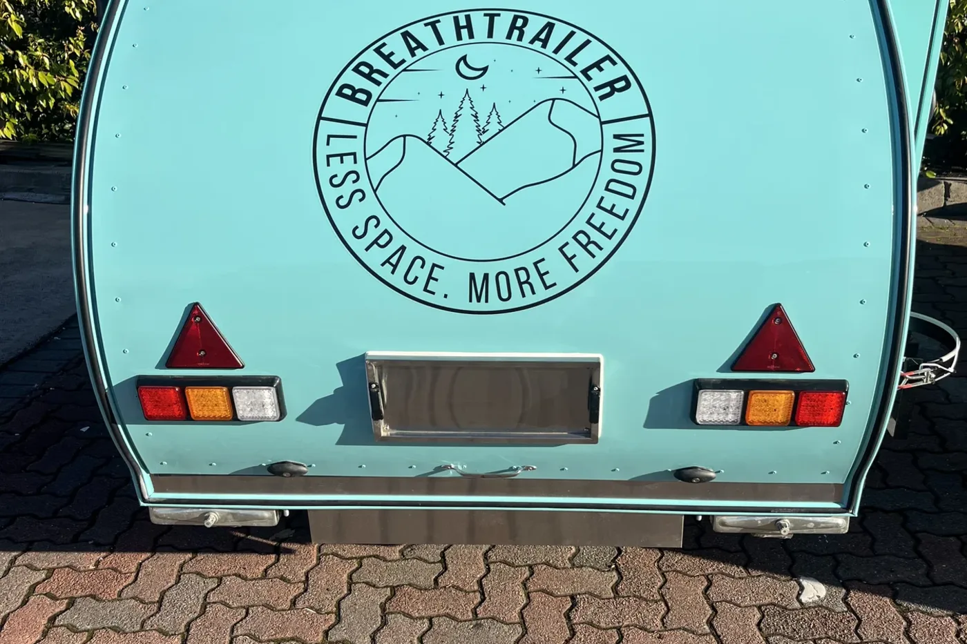 Breath Essential teardrop camper rear hatch in teal
