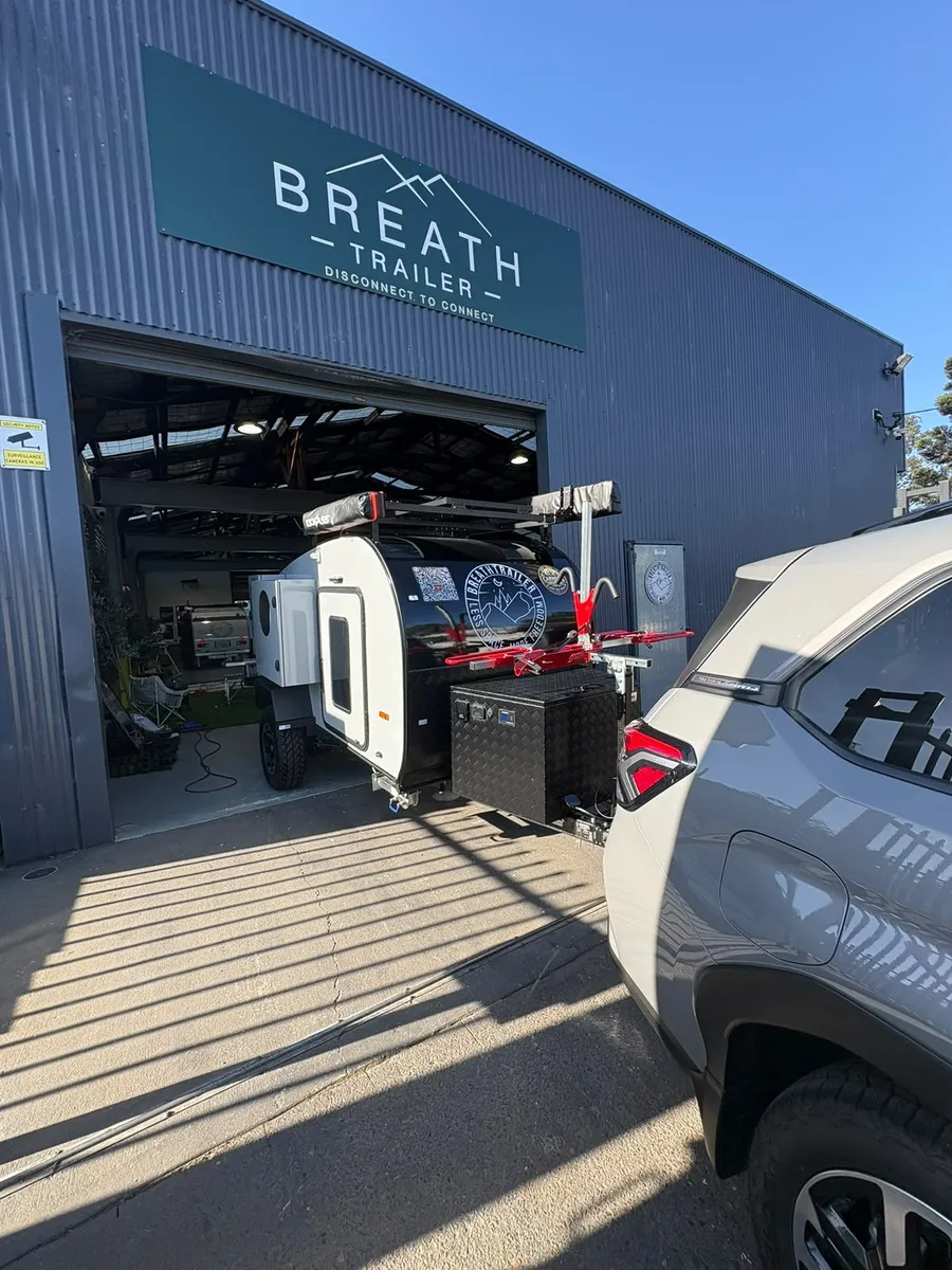Breath Trailer showroom and workshop in Holroyd, Sydney, with a Breath teardrop camper at the roller door