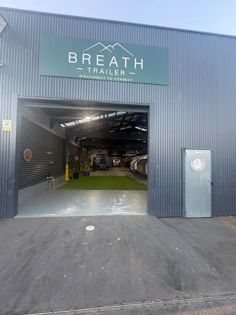 Breath Trailer showroom entrance in Holroyd, Sydney, with the green Breath Trailer sign above the roller door